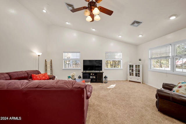 carpeted living room with high vaulted ceiling and ceiling fan