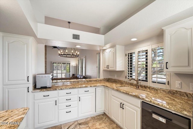 kitchen with a sink, light stone counters, dishwasher, and white cabinetry