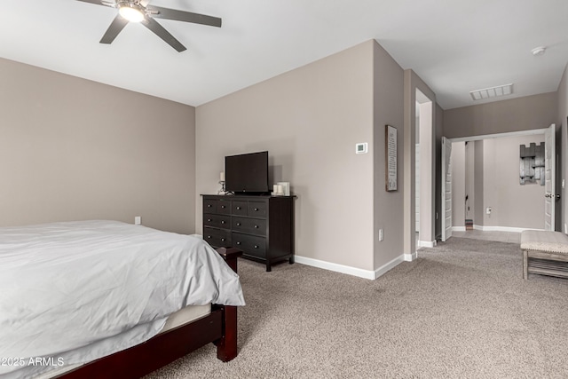 carpeted bedroom with baseboards, visible vents, and ceiling fan