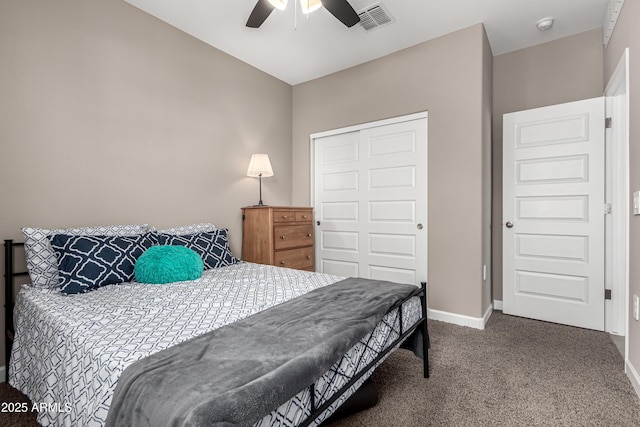 carpeted bedroom featuring a ceiling fan, a closet, visible vents, and baseboards