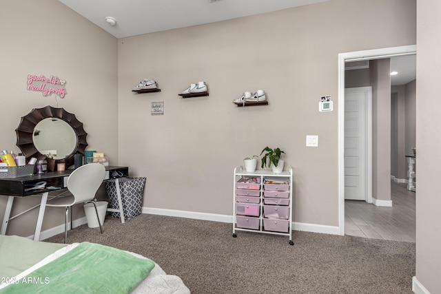 bedroom with carpet and baseboards