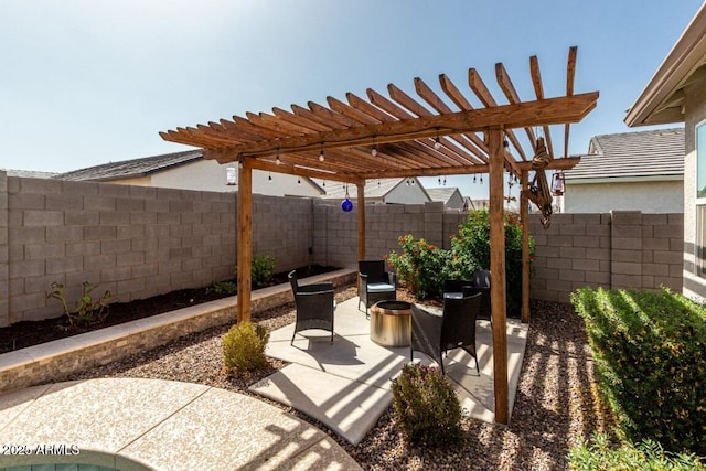 view of patio / terrace with a fenced backyard and a pergola