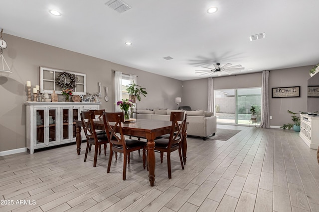 dining room with a healthy amount of sunlight, light wood finished floors, and visible vents