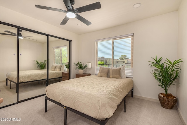 461 W Holmes Ave Unit 323, Mesa, AZ 85210 - carpeted bedroom featuring a ceiling fan and a closet