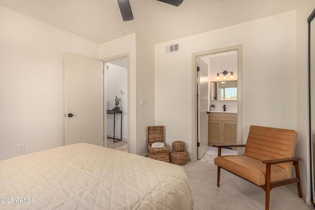 461 W Holmes Ave Unit 323, Mesa, AZ 85210 - bedroom with light colored carpet, ensuite bath, and ceiling fan