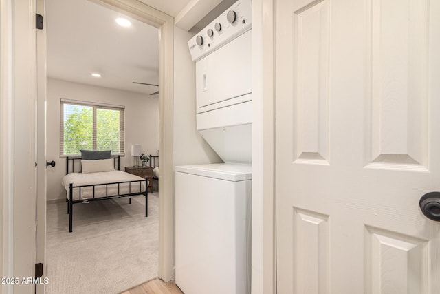 461 W Holmes Ave Unit 323, Mesa, AZ 85210 - washroom featuring stacked washer / drying machine, recessed lighting, and light wood-type flooring