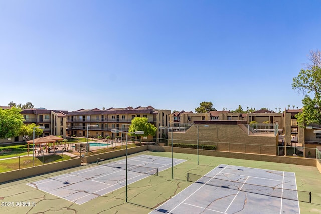461 W Holmes Ave Unit 323, Mesa, AZ 85210 - view of property's community featuring a tennis court, uncovered parking, and a residential view
