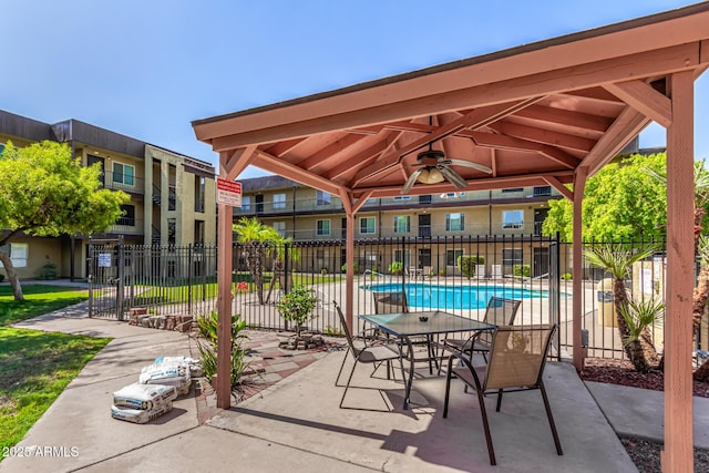 461 W Holmes Ave Unit 323, Mesa, AZ 85210 - view of patio with a ceiling fan, a gazebo, and a community pool
