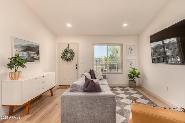 461 W Holmes Ave Unit 323, Mesa, AZ 85210 - living room featuring vaulted ceiling, light wood finished floors, and recessed lighting
