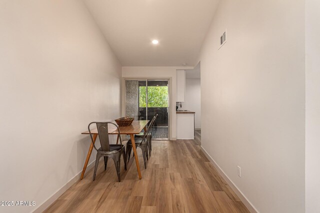 461 W Holmes Ave Unit 323, Mesa, AZ 85210 - dining area featuring light wood-type flooring and recessed lighting