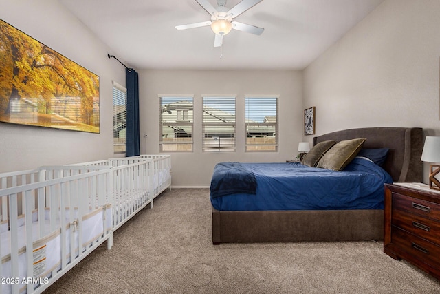 carpeted bedroom featuring ceiling fan