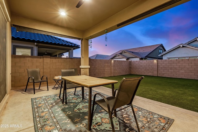 view of patio / terrace featuring outdoor dining area and fence