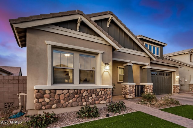 craftsman inspired home with a garage