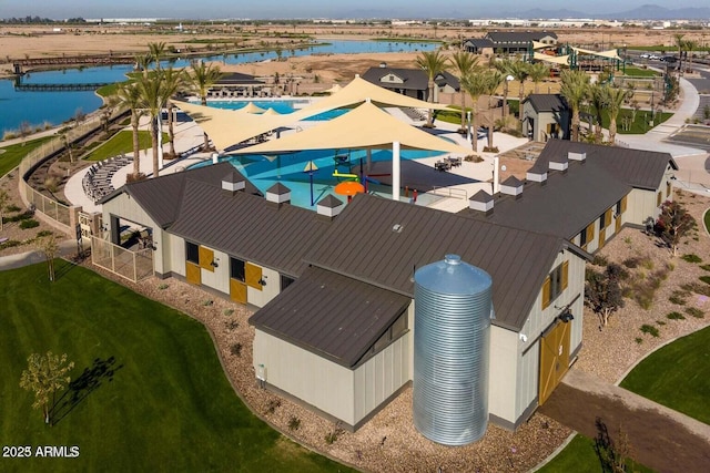 birds eye view of property featuring a water view and a residential view