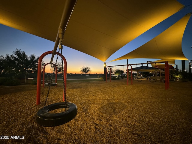 yard at dusk featuring a gazebo