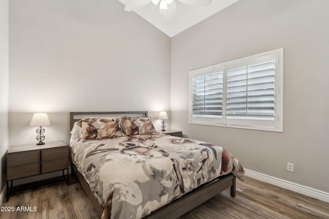 bedroom with lofted ceiling, dark wood-type flooring, and ceiling fan