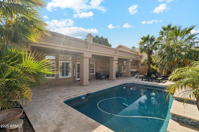 view of pool featuring a patio