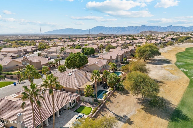 birds eye view of property featuring a mountain view