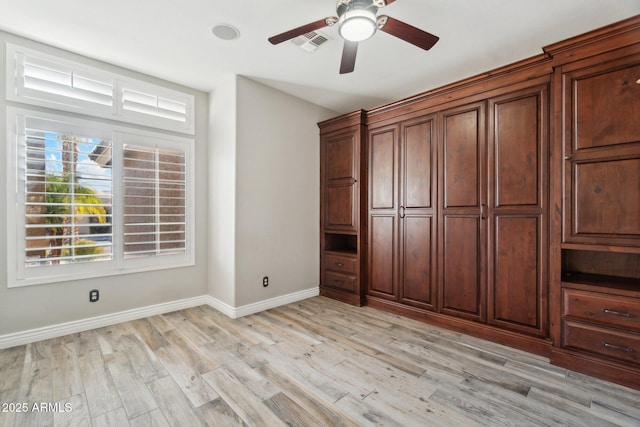 unfurnished bedroom featuring ceiling fan and light wood-type flooring