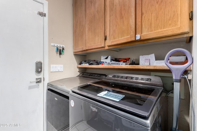 interior space featuring separate washer and dryer and cabinet space