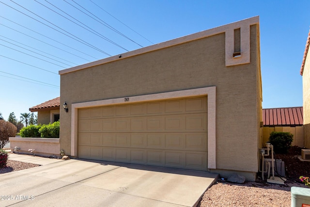 exterior space with concrete driveway