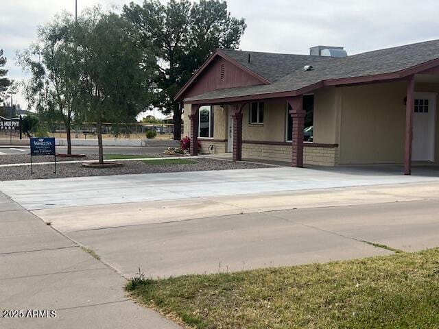 7136 W Cheryl Dr, Peoria, AZ 85345 - view of front of house featuring brick siding and a shingled roof