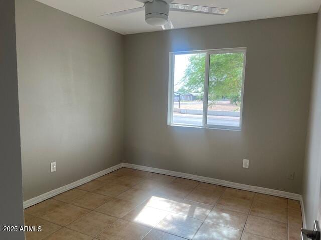7136 W Cheryl Dr, Peoria, AZ 85345 - spare room with light tile patterned flooring, baseboards, and a ceiling fan