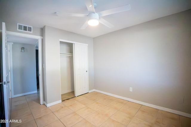 7136 W Cheryl Dr, Peoria, AZ 85345 - unfurnished bedroom featuring light tile patterned floors, a closet, baseboards, and visible vents