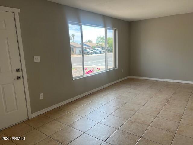 7136 W Cheryl Dr, Peoria, AZ 85345 - empty room featuring baseboards and light tile patterned flooring