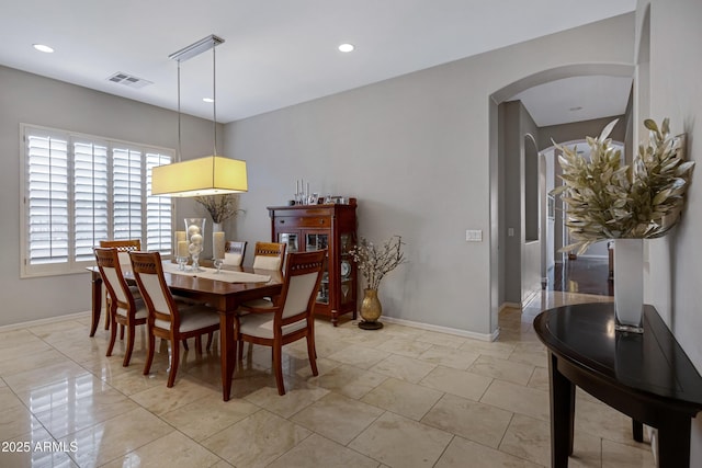 6694 S Banning St, Gilbert, AZ 85298 - dining space featuring arched walkways, visible vents, baseboards, and recessed lighting