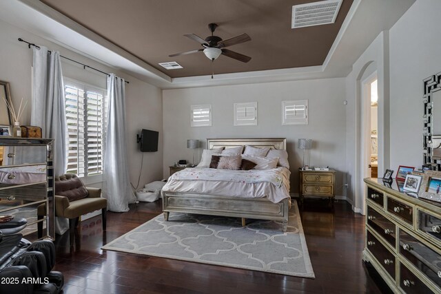 6694 S Banning St, Gilbert, AZ 85298 - bedroom with wood finished floors, a tray ceiling, and visible vents
