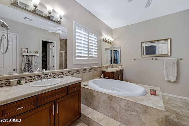 6694 S Banning St, Gilbert, AZ 85298 - bathroom featuring a garden tub, visible vents, a sink, and ceiling fan