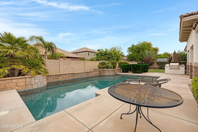 6694 S Banning St, Gilbert, AZ 85298 - view of pool with a fenced in pool, an outdoor kitchen, a patio, and a fenced backyard