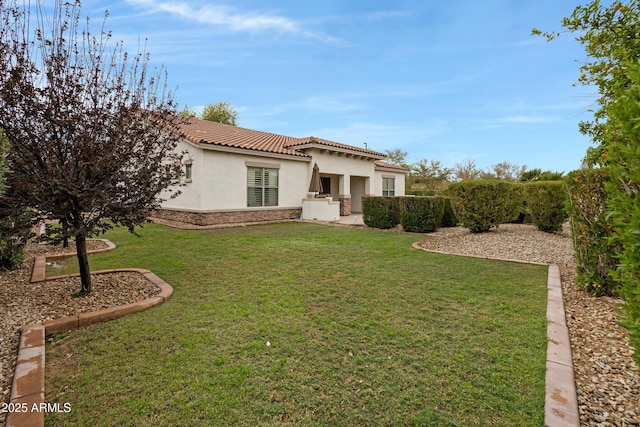 6694 S Banning St, Gilbert, AZ 85298 - view of front of house with stone siding, a tiled roof, a front lawn, and stucco siding
