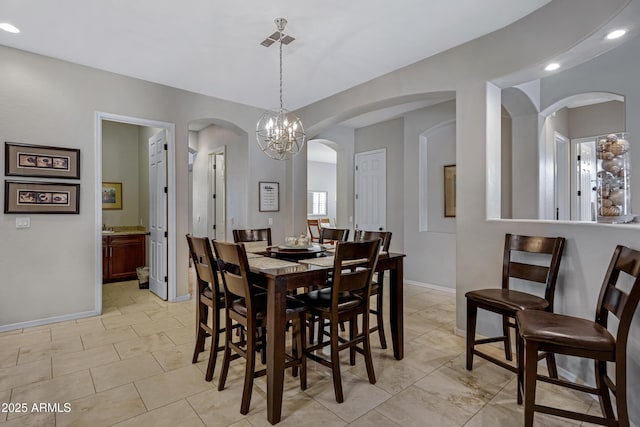 6694 S Banning St, Gilbert, AZ 85298 - dining area featuring a notable chandelier, baseboards, arched walkways, and recessed lighting