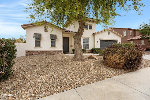 6694 S Banning St, Gilbert, AZ 85298 - mediterranean / spanish-style home with a garage, a tiled roof, stone siding, and stucco siding