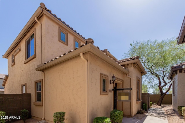 21136 N 36th Pl, Phoenix, AZ 85050 - view of home's exterior featuring a tiled roof and stucco siding