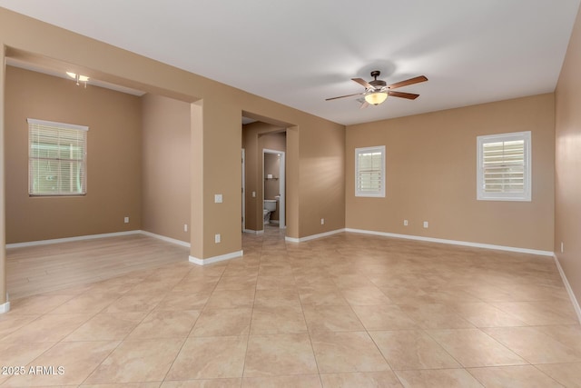 21136 N 36th Pl, Phoenix, AZ 85050 - empty room with a ceiling fan and light tile patterned floors