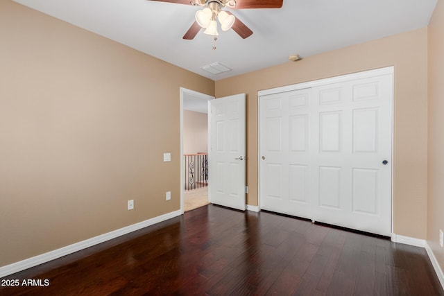 21136 N 36th Pl, Phoenix, AZ 85050 - unfurnished bedroom featuring dark wood-type flooring, a closet, and ceiling fan