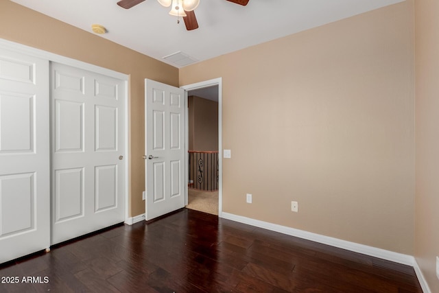 21136 N 36th Pl, Phoenix, AZ 85050 - unfurnished bedroom featuring dark wood-style floors, a ceiling fan, and a closet