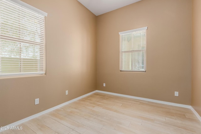 21136 N 36th Pl, Phoenix, AZ 85050 - unfurnished room featuring wood finished floors and baseboards