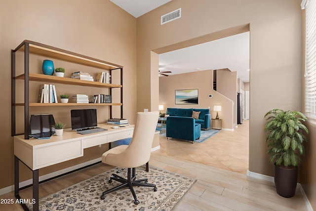 21136 N 36th Pl, Phoenix, AZ 85050 - office space with ceiling fan, wood finished floors, built in study area, and a towering ceiling