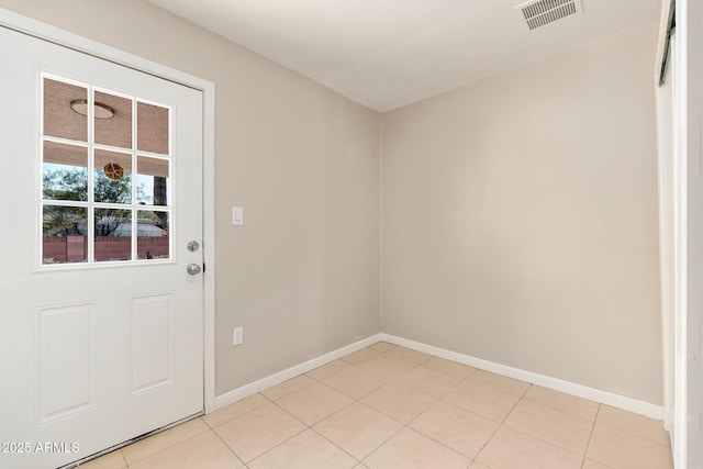 doorway to outside featuring light tile patterned floors