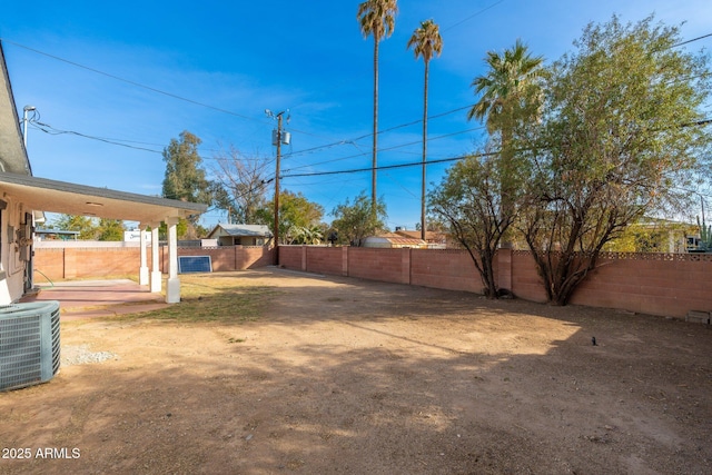 view of yard featuring central AC unit