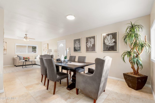 dining area featuring light tile patterned flooring and ceiling fan