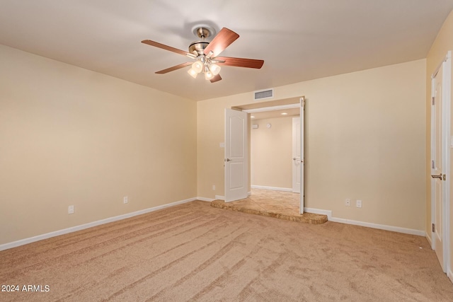 unfurnished bedroom with baseboards, a ceiling fan, visible vents, and carpet floors