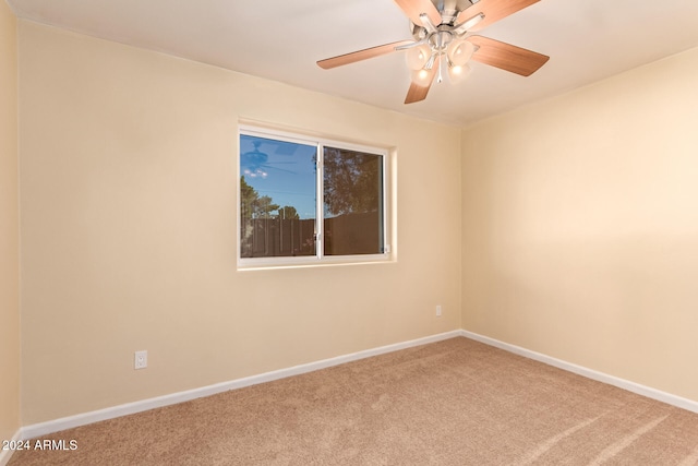 unfurnished room featuring carpet floors and ceiling fan