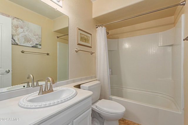 bathroom with shower / tub combo, vanity, and toilet