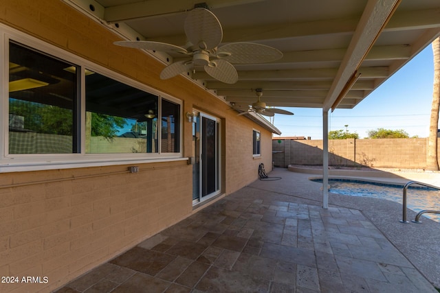 view of patio with a fenced backyard, a ceiling fan, and a fenced in pool