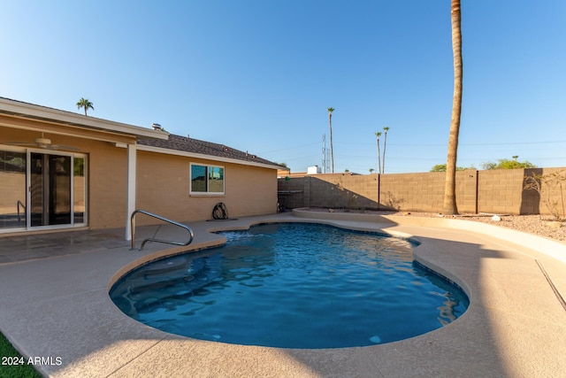 view of swimming pool with a fenced backyard, a fenced in pool, and a patio